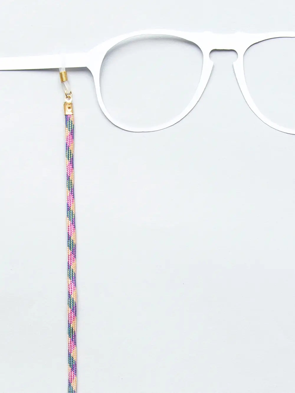 Brillenband Paracord pink, gelb und blau gezackt an weissem Brillenmodell auf weissem Hintergrund
