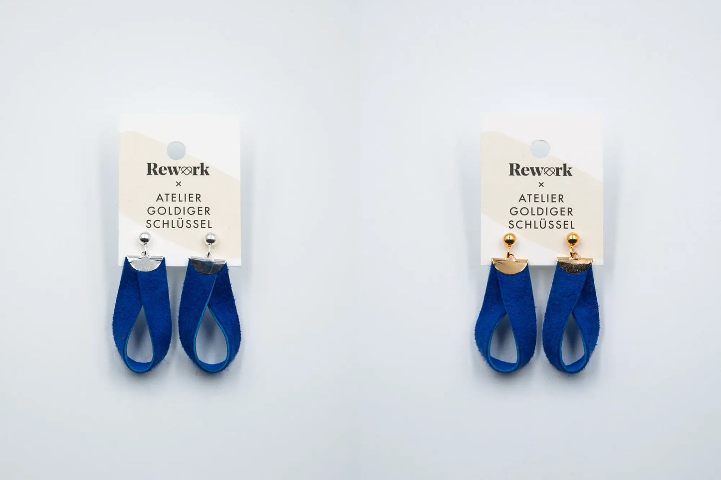 Ohrhänger aus blauem Recycling Leder mit goldenen und silbernen Metallteilen an Etikette auf weissem Hintergund