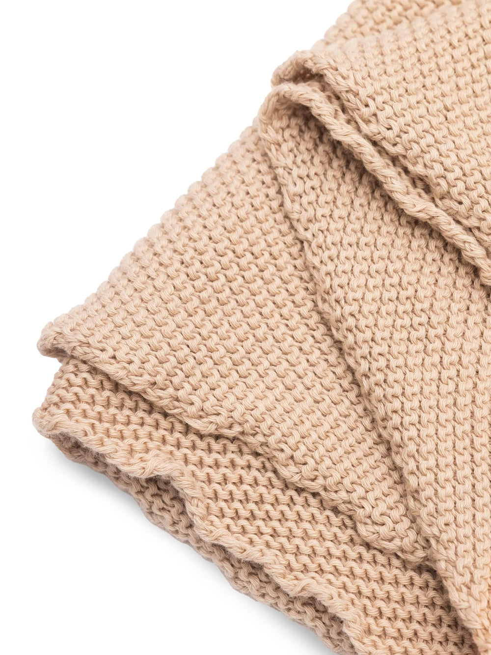 Detailaufnahme eines beigen gestrickten Schals.