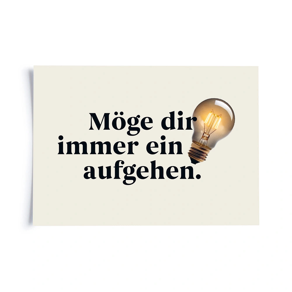 Postkarte auf weissem Hintergrund mit einem abgewandelten Sprichwort «Möge dir immer ein Licht aufgehen.»