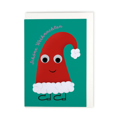 türkis farbene Faltkarte mit illustrierter Nikolausmütze und aufgeklebten Wackelaugen mit weissem Couvert auf weissem Hintergrund