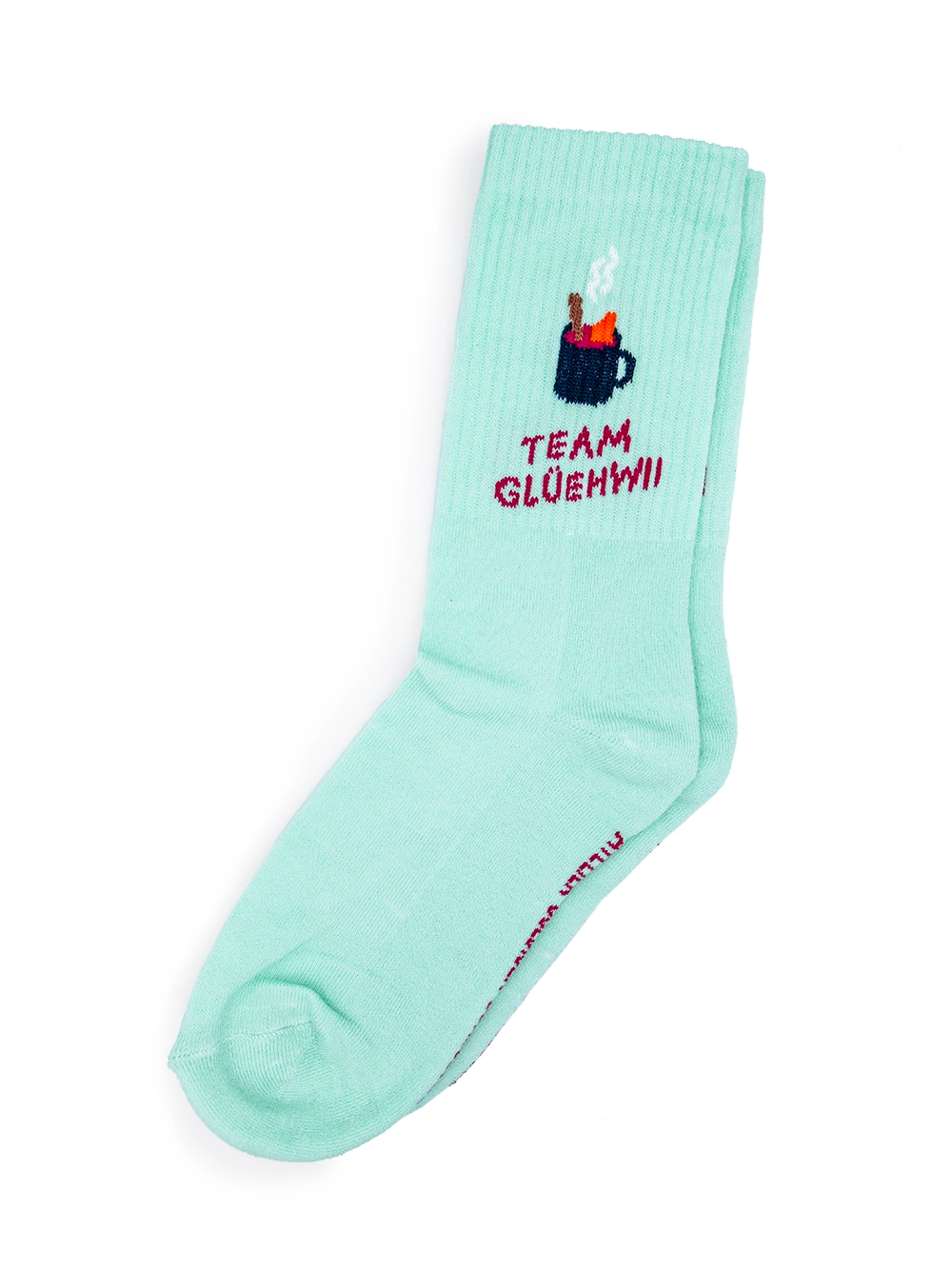 Aufsicht auf mint farbene Socken mit dem Schriftzug Team Glühwein auf weissem Untergrund.